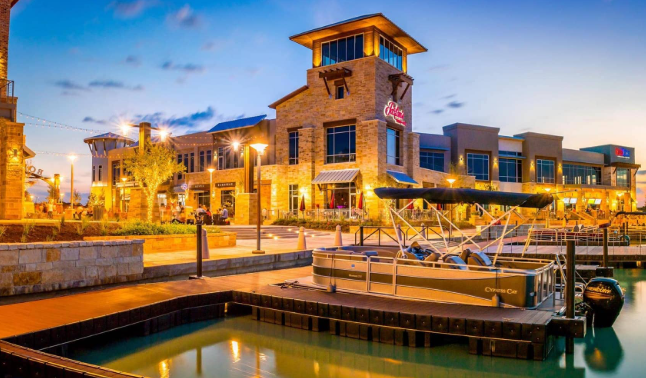Cypress Texas Towne Lake waterfront retail at dusk — family law attorney Houston TX serving Cypress