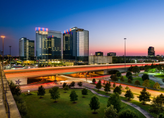 Energy Corridor Houston Texas at dusk with I-10 light trails — family law attorney Houston TX serving Energy Corridor executive divorce