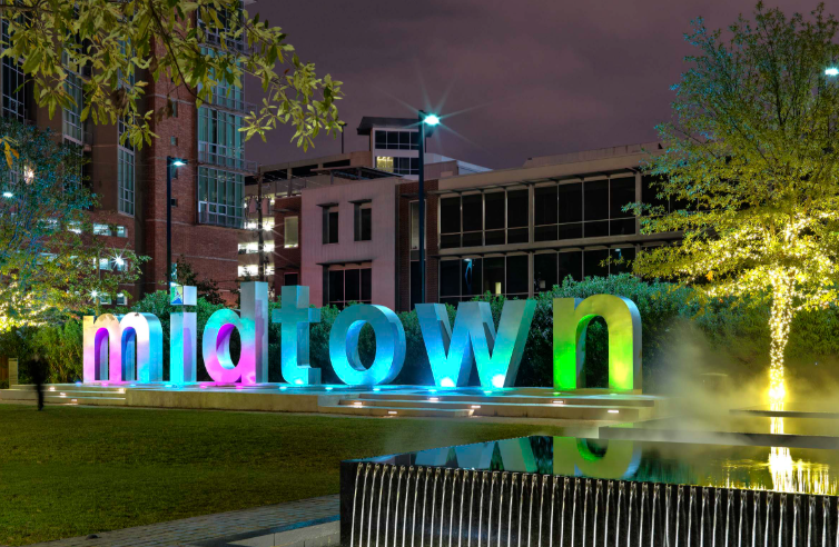 Midtown Houston illuminated sign at night — family law attorney Houston TX serving Midtown divorce and custody cases