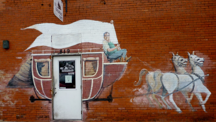 Historic Rosenberg Texas downtown Vogelsang Building stagecoach mural &mdash; family law attorney Rosenberg TX